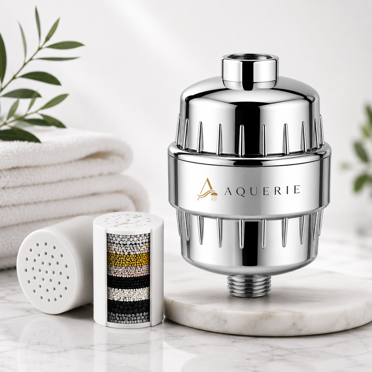 AQUERIE Rituel shower filter on white marble in a modern bathroom with the replaceable cartridge