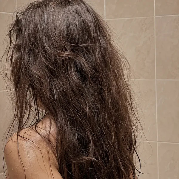 Long wavy hair before and after switching to filtered shower water