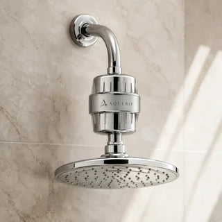 AQUERIE Rituel shower filter fitted to a wall mounted shower arm above a fixed rain head